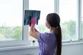 Young woman doctor looking at xray radiography images at clinic. Physician, surgeon reviewing scan of patient bones