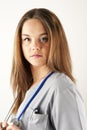 Young woman doctor or nurse wearing scrubs Royalty Free Stock Photo