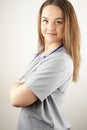 Young woman doctor or nurse wearing scrubs