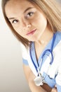 Young woman doctor or nurse wearing scrubs Royalty Free Stock Photo