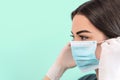 Young woman doctor portrait wearing surgical face mask and gloves - People working for preventing and stop corona virus spreading