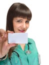 Young woman doctor showing empty blank clipboard sign with copy space for text. Royalty Free Stock Photo