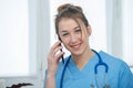 Young woman doctor talking on the phone Royalty Free Stock Photo