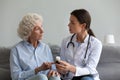 Female doctor consult senior patient about medicine prescription Royalty Free Stock Photo