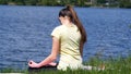 Young woman does exercises bends head to-and-fro.