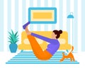 A young woman does sports, yoga in a cozy home interior with a cat. Lifestyle.