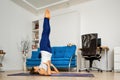 Woman does supported shoulderstand yoga pose Royalty Free Stock Photo