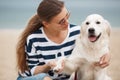 Young woman with a dog on a deserted beach Royalty Free Stock Photo