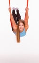 Young woman doing anti-gravity aerial yoga in Royalty Free Stock Photo