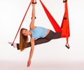 Young woman doing anti-gravity aerial yoga in Royalty Free Stock Photo