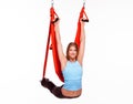 Young woman doing anti-gravity aerial yoga in Royalty Free Stock Photo
