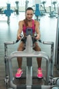 Young Woman Doing Back Exercise In Fitness Center Royalty Free Stock Photo