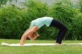 Young woman doing Bridge Pose in Yoga