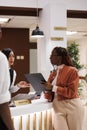 Young woman doing check in process Royalty Free Stock Photo