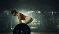 Young woman doing deadlift with heavy bar in gym, strong female athlete with muscular body lifting weights, exercising with Royalty Free Stock Photo