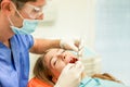 Young woman doing dental treatment - Girl having annual check visit by dentist - People bodycare and stomatology concept for Royalty Free Stock Photo