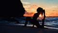 Young woman doing exercise on beach Royalty Free Stock Photo