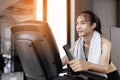 Young woman doing exercise cardio on a stationary bike at gym Royalty Free Stock Photo