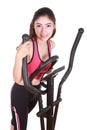 Young woman doing exercises with exercise machine Royalty Free Stock Photo