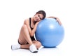 Young woman doing exercises with fitness ball