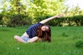 Young woman doing exercises during fitness training in the park on a summer day. Royalty Free Stock Photo