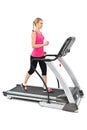 Young woman doing exercises on treadmill