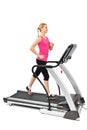 Young woman doing exercises on treadmill