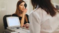 Young woman doing eye test with optometrist in medical center Royalty Free Stock Photo