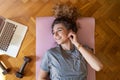 Young woman doing fitness exercise at home