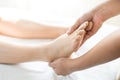 Young woman doing foot massage in spa massage parlor Royalty Free Stock Photo