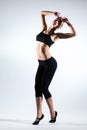 Young woman doing gymnastic exercise