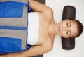 Young woman doing a pressotherapy treatment in a clinic. Body care