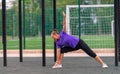 Young woman doing a side lunge and stretch Royalty Free Stock Photo