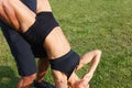 Young woman doing sit ups with personal trainer Royalty Free Stock Photo