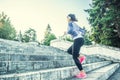 Young woman doing sports and running up the stairs Royalty Free Stock Photo