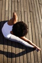 Young woman doing stretching exercise at beach Royalty Free Stock Photo
