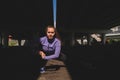 Woman doing a workout under a bridge, dark moody photo, active lifestyle concept