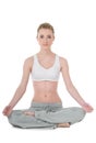 Young woman doing yoga, easy / Sukhasana position Royalty Free Stock Photo