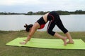 Young woman doing yoga exercise in park Royalty Free Stock Photo