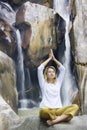 Young woman doing yoga exercises