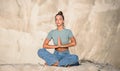 Young woman doing yoga exercises outdoor in the white mountains. Relax yoga at the top of the mountain Royalty Free Stock Photo