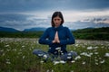 A young woman doing yoga in the field