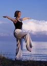 Young woman doing yoga outside