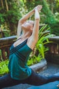 Young woman doing yoga outside in natural environment Royalty Free Stock Photo