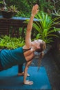 Young woman doing yoga outside in natural environment Royalty Free Stock Photo