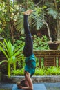 Young woman doing yoga outside in natural environment Royalty Free Stock Photo