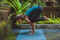 Young woman doing yoga outside in natural environment Royalty Free Stock Photo