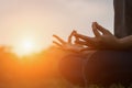 Young woman doing yoga in the park with sunset Royalty Free Stock Photo