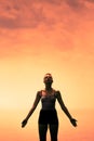 Young Woman doing Yoga Position in Front of the Ocean Royalty Free Stock Photo