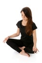 Young woman doing yoga, Sukhasana easy sitting pose. Royalty Free Stock Photo
